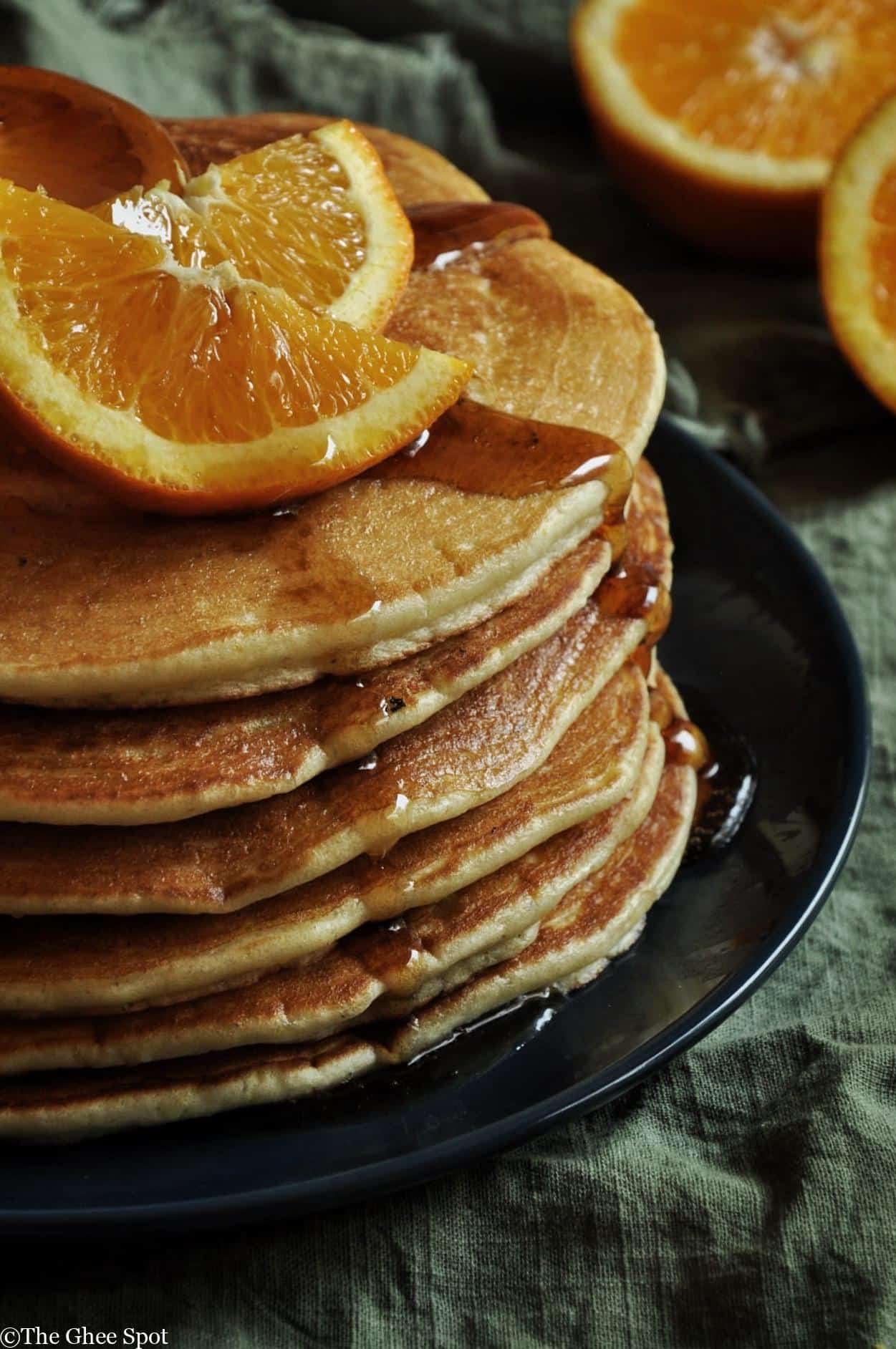 fresh orange juice and cardamom make these pancakes light and delicious.