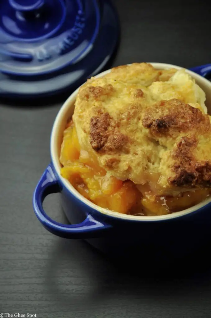 Rich, warm, and sweet peach cobbler with cardamom